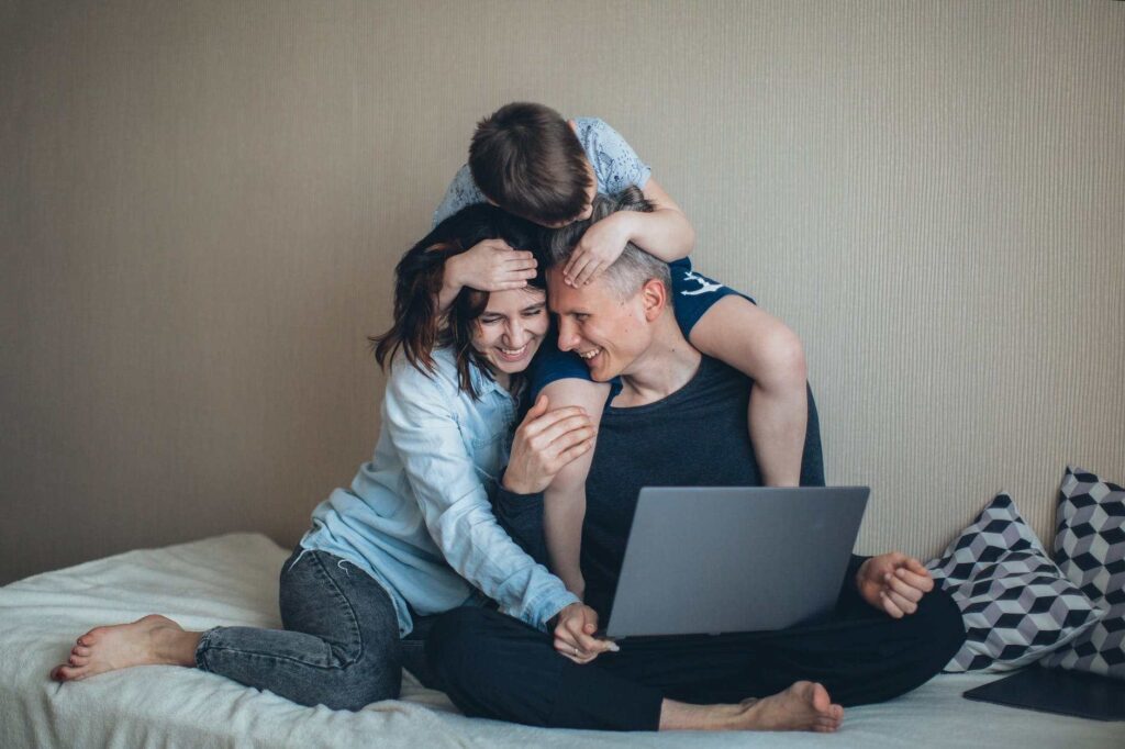 family sitting in virtual counselling session